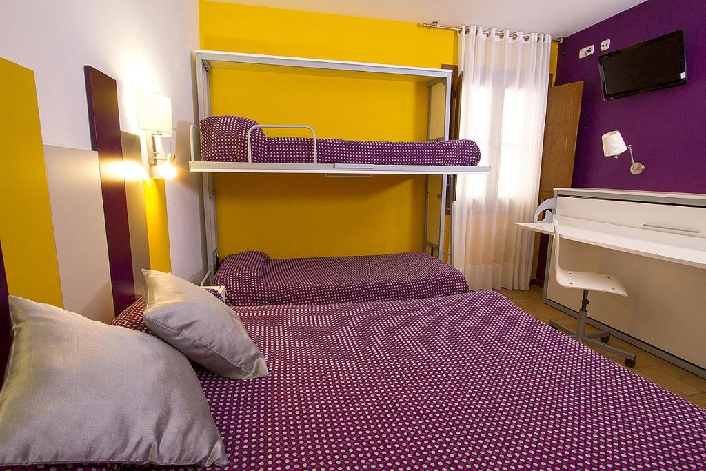 Postel nebo postele na pokoji v ubytování Hotel Antiga