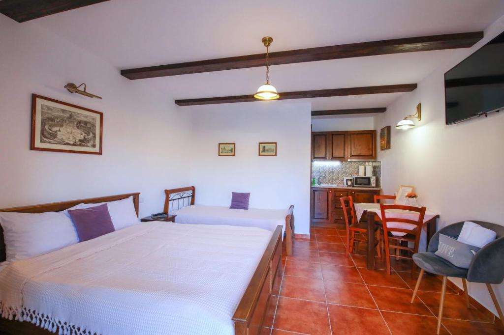 Postel nebo postele na pokoji v ubytování AMA Guest House