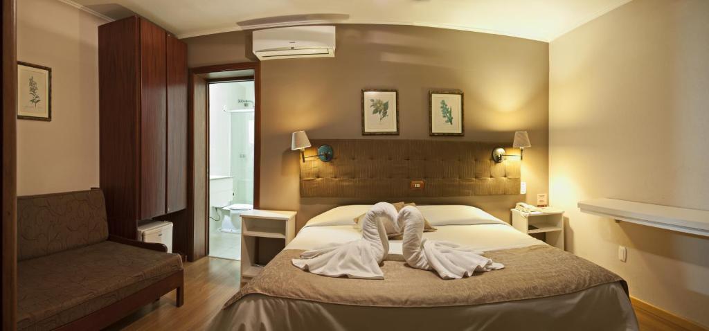 Кровать или кровати в номере Bellagio Mini Resort - no coração de Gramado