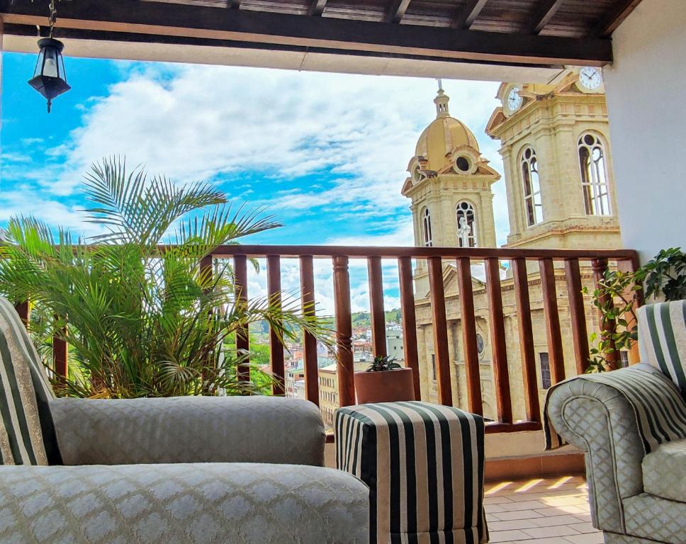 a balcony with a view of a church at Apartamento con espectaculares vistas en el centro histórico in Socorro