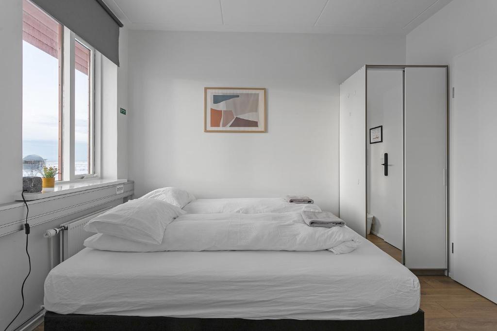Postel nebo postele na pokoji v ubytování Bank Guesthouse by KEF Airport