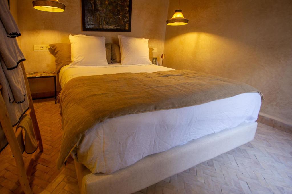 Postel nebo postele na pokoji v ubytování Maison Riad Beryll