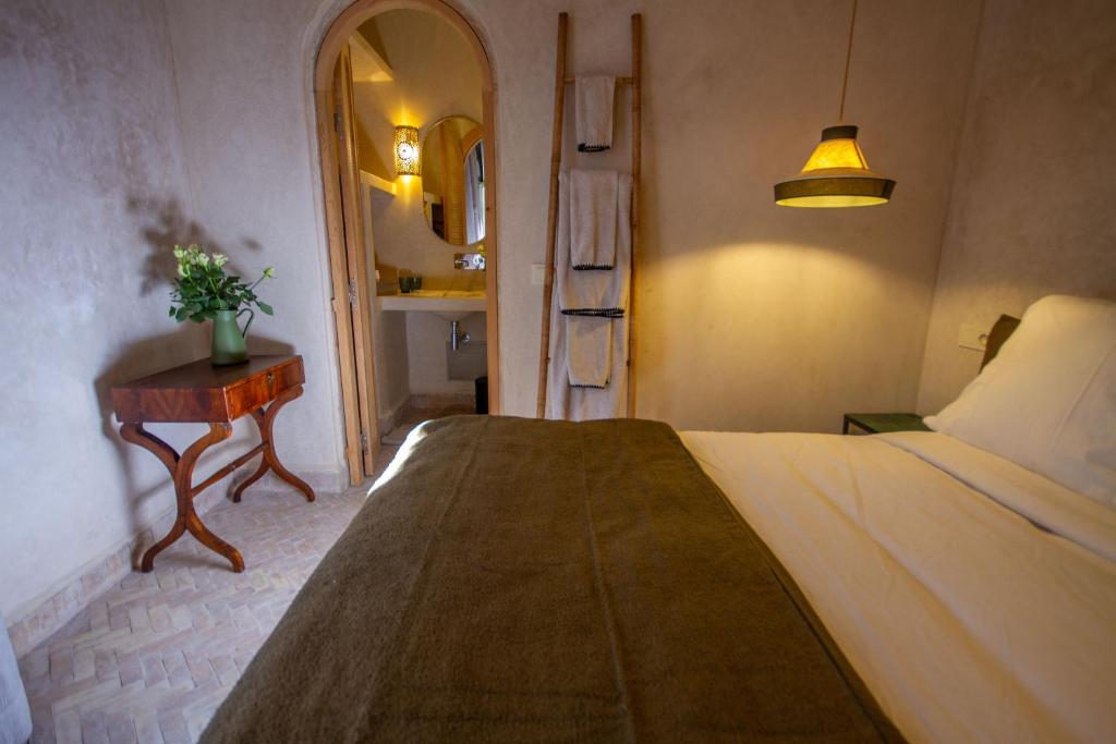 Postel nebo postele na pokoji v ubytování Maison Riad Beryll