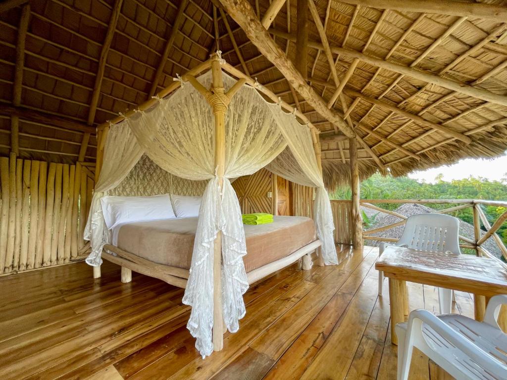 a bedroom with a canopy bed in a room at Rancho Romana Retreat N-05 in El Limón