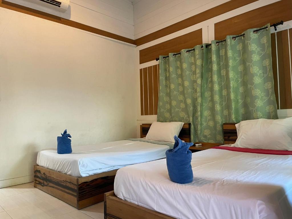 Llit o llits en una habitació de Phi Phi Twin Palms Bungalow