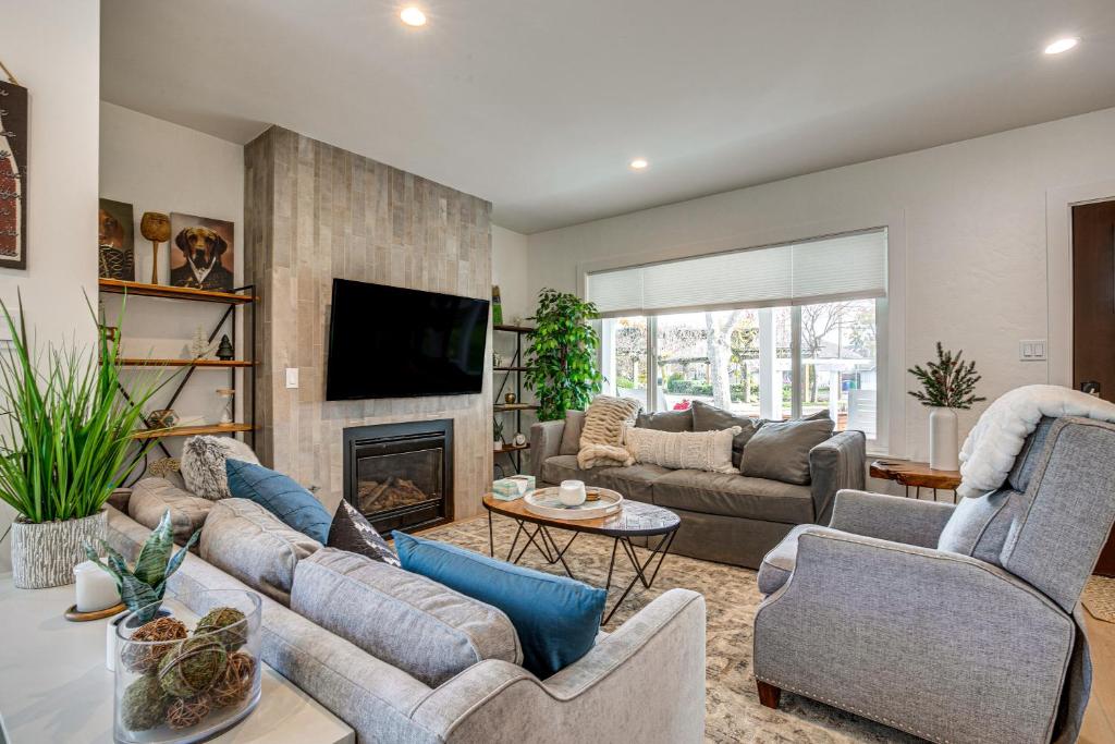 a living room with couches and a fireplace at Central Napa Vacation Rental - Walk Downtown! in Napa