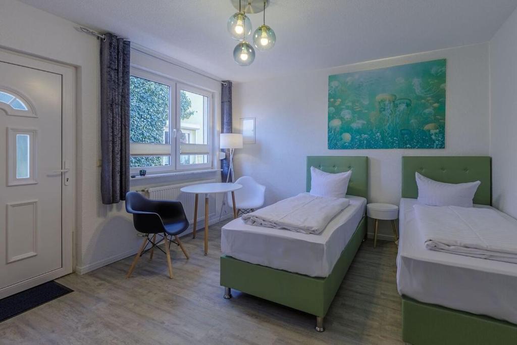 Postel nebo postele na pokoji v ubytování Hafenhaus Unterwasserwelt