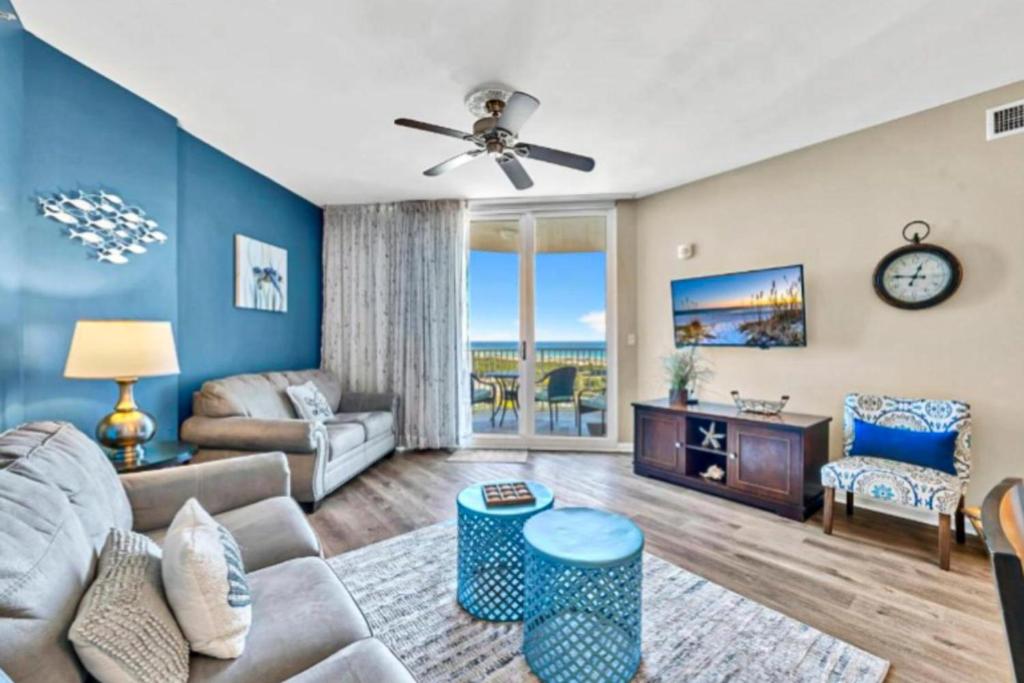 a living room with a couch and a table at Palms of Destin 21211 in Destin