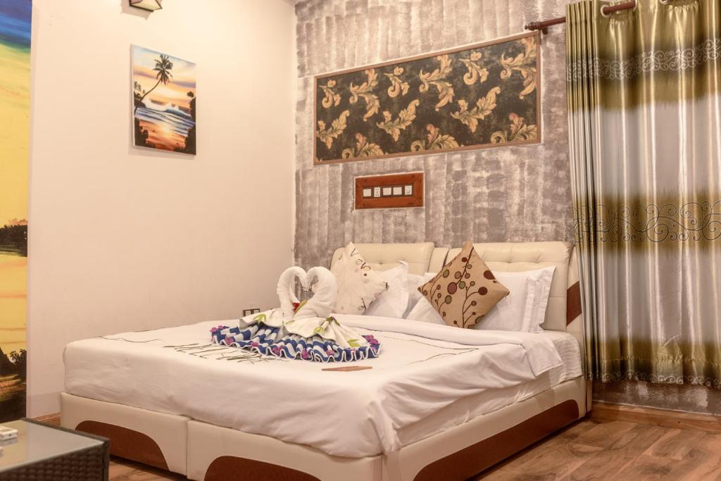 Postel nebo postele na pokoji v ubytování Coral Queen Villa, Ukulhas