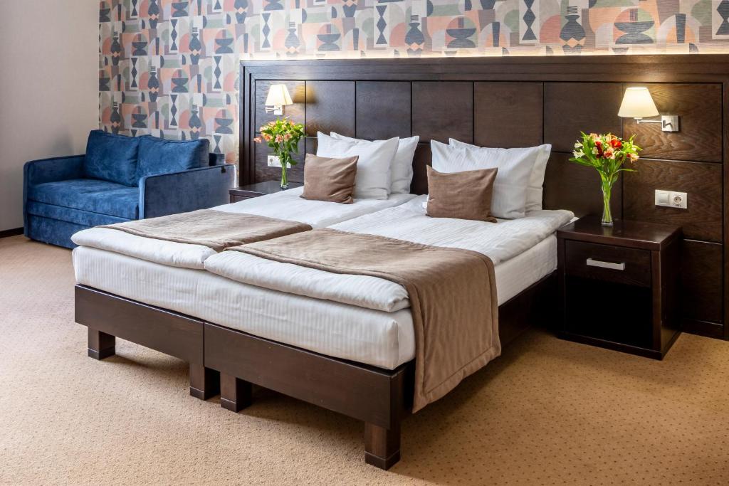 Ліжко або ліжка в номері Taurus Hotel & SPA