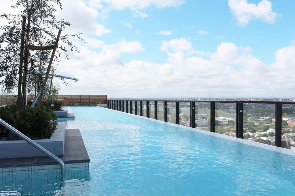 a swimming pool on top of a building at Luxurious Flemington with Stunning Racecourse View in Melbourne