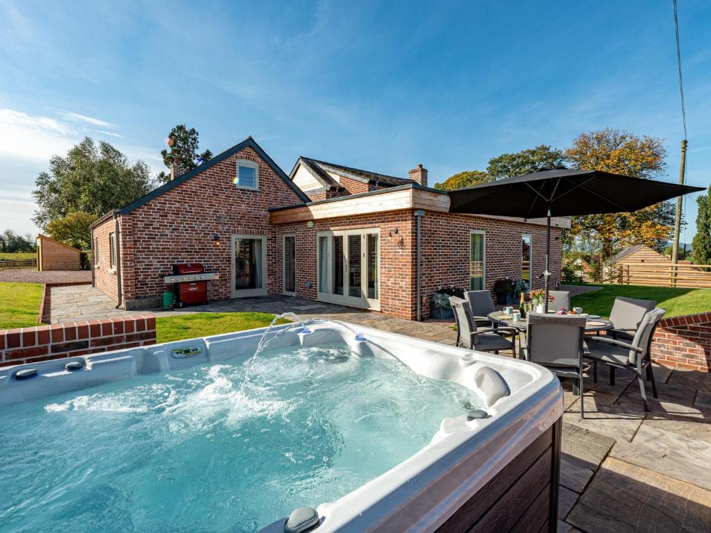 a hot tub in the backyard of a house at 3 Bed in Madley 83659 in Madley