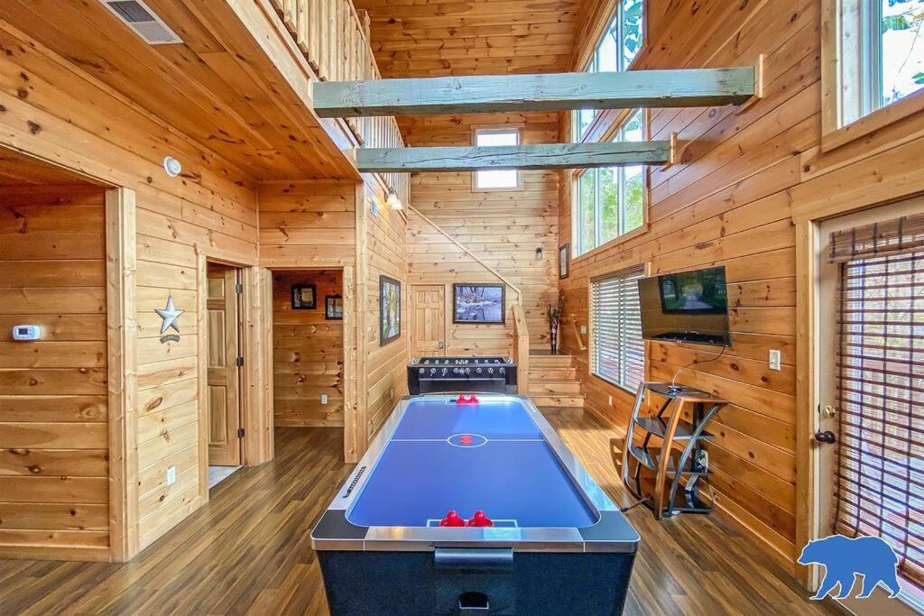 a pool table in a room with wooden walls at Blue Bear Lodge near Dollywood! 1 mile off PKWY Community Pool Hot tub Game Rm in Pigeon Forge
