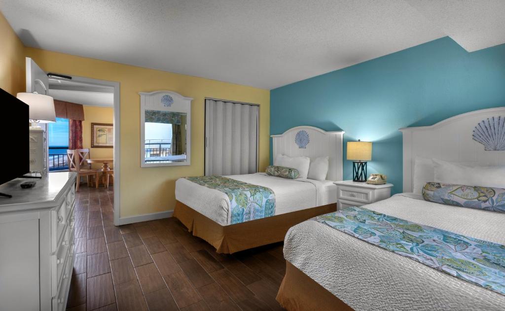 Voodi või voodid majutusasutuse Monterey Bay Suites toas