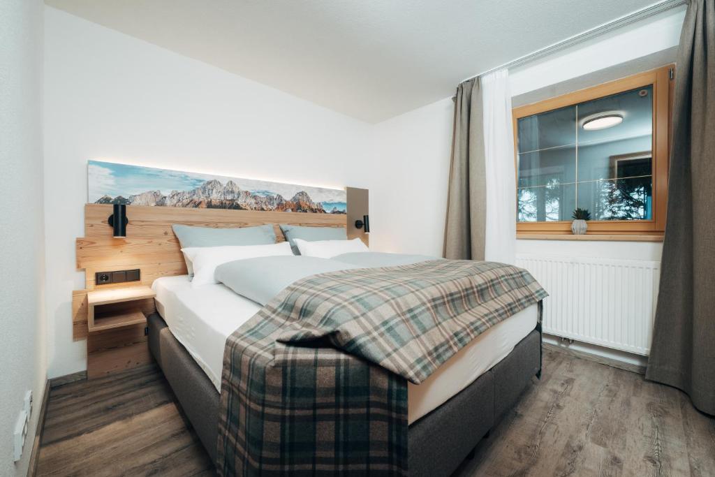 Postel nebo postele na pokoji v ubytování Living Mountain Tannheim