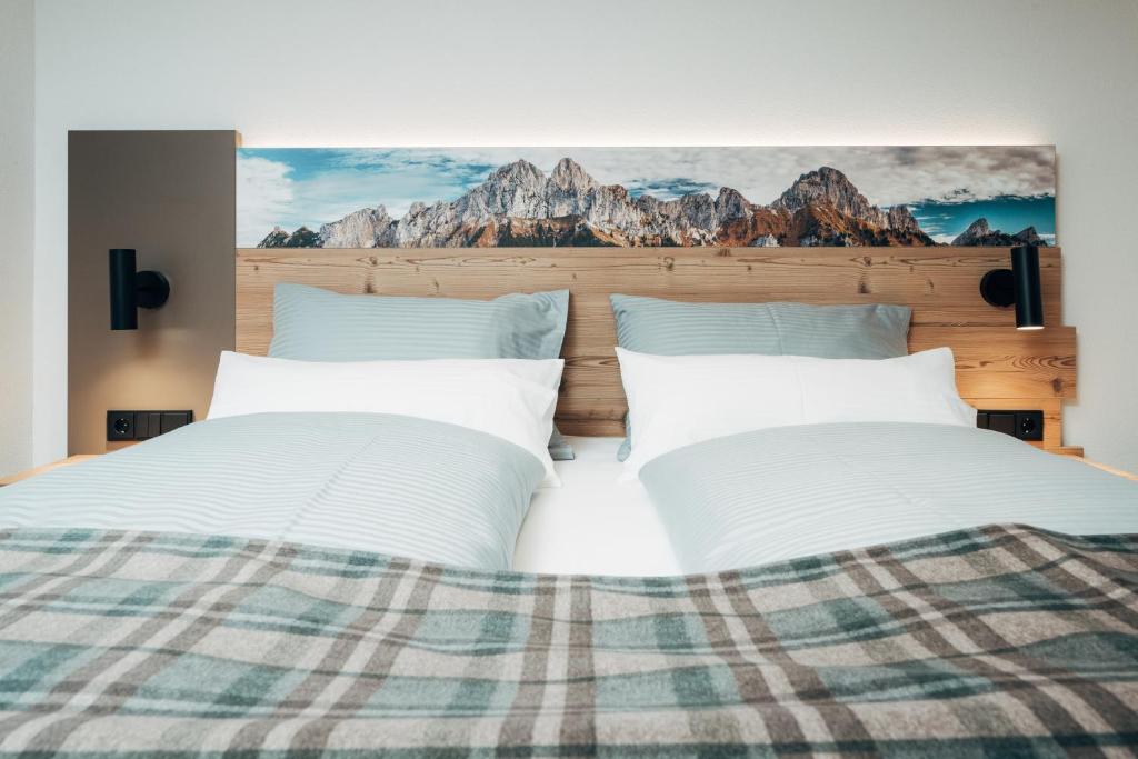 Postel nebo postele na pokoji v ubytování Living Mountain Tannheim