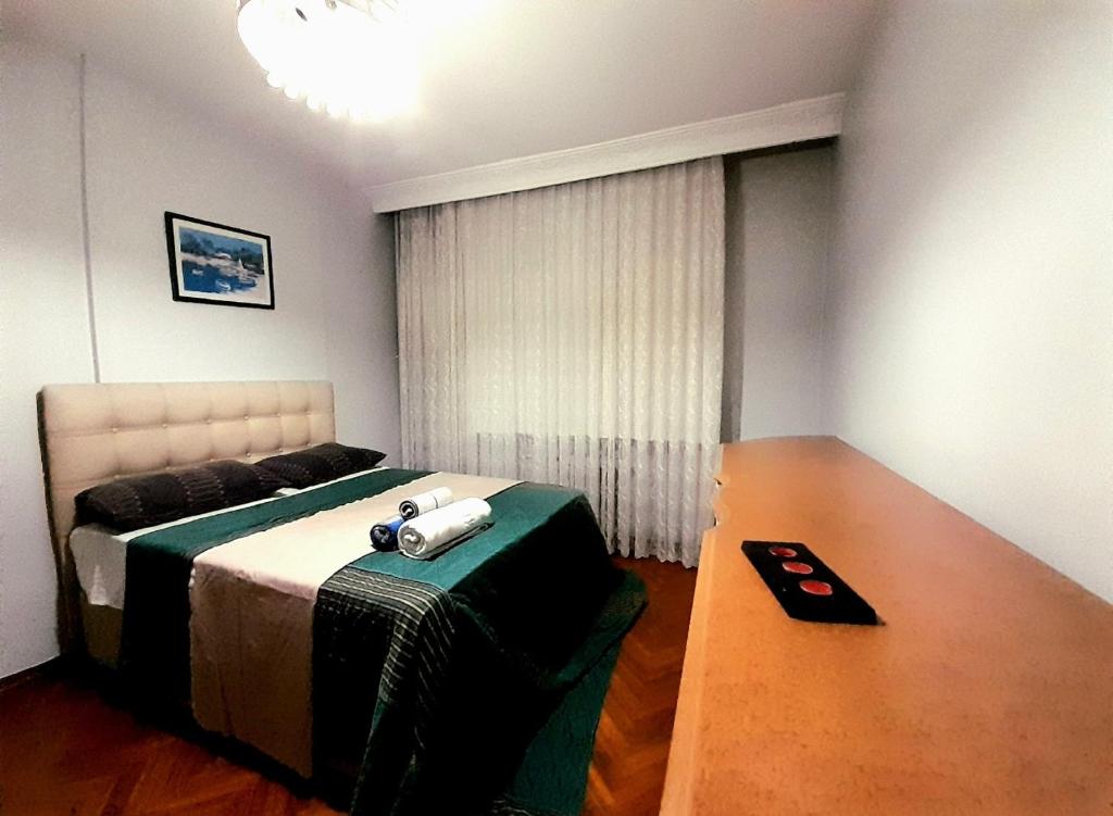 a bedroom with a bed with a camera on it at İstanbul Kadıköy Şenesenevlerde Nezih Metroya Beş Dakika in Istanbul