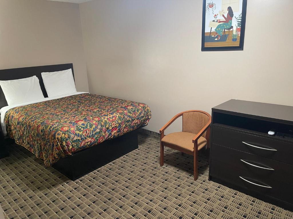 Economy Inn & Suites - Habitación De La Reina