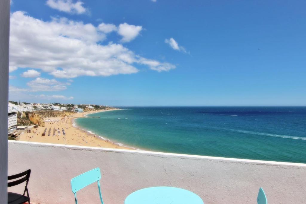 a view of the beach from the balcony of a condo at Casa dos Tios in Albufeira