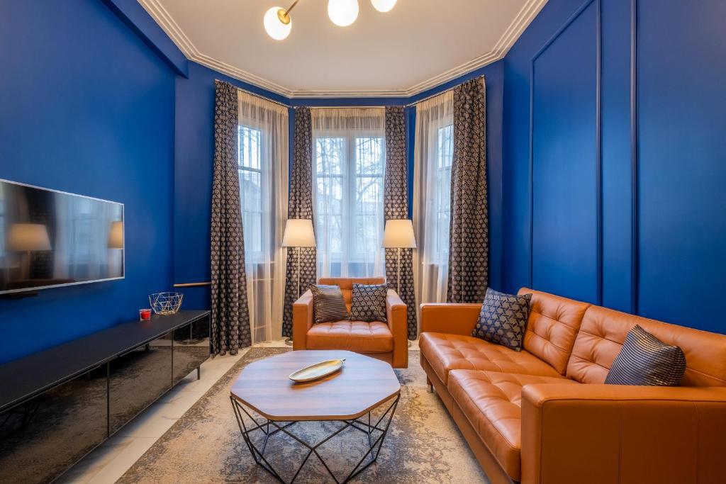 a blue living room with a couch and a table at Sofia’s Classy Blu -2 Bedrooms in Sofia