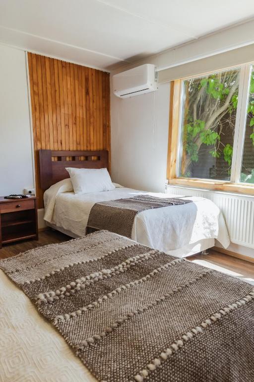 Postel nebo postele na pokoji v ubytování Hostal Viento Sur
