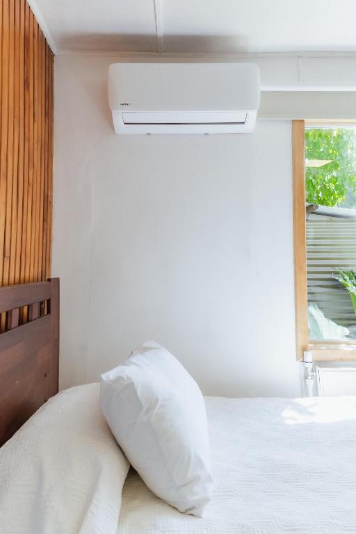 Postel nebo postele na pokoji v ubytování Hostal Viento Sur