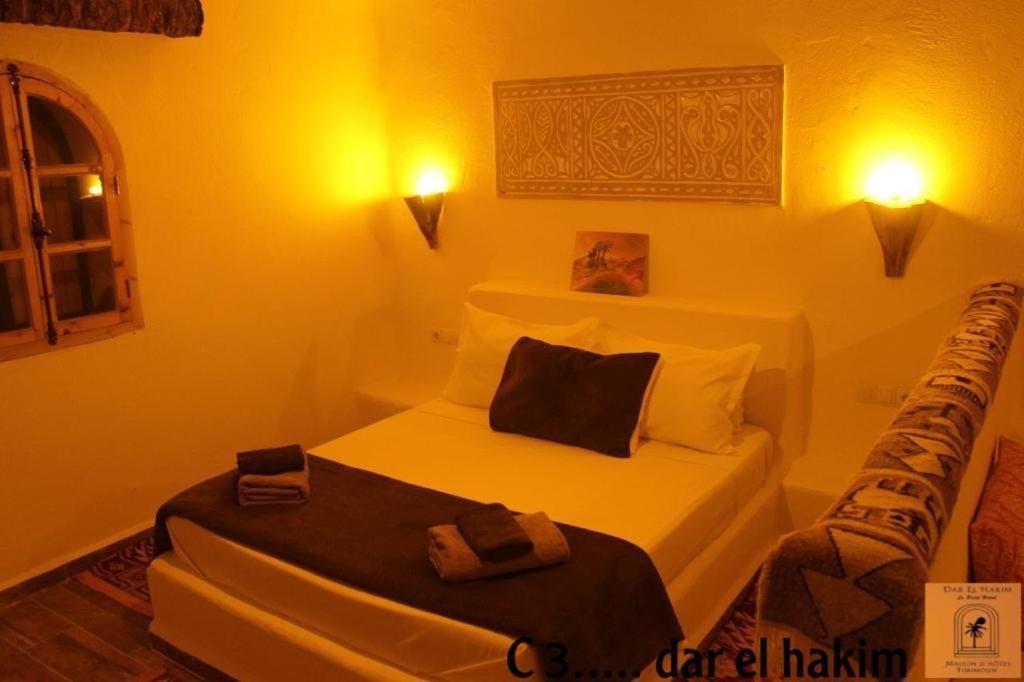 Un pat sau paturi într-o cameră la Dar El Hakim, le petit hôtel de Timimoun