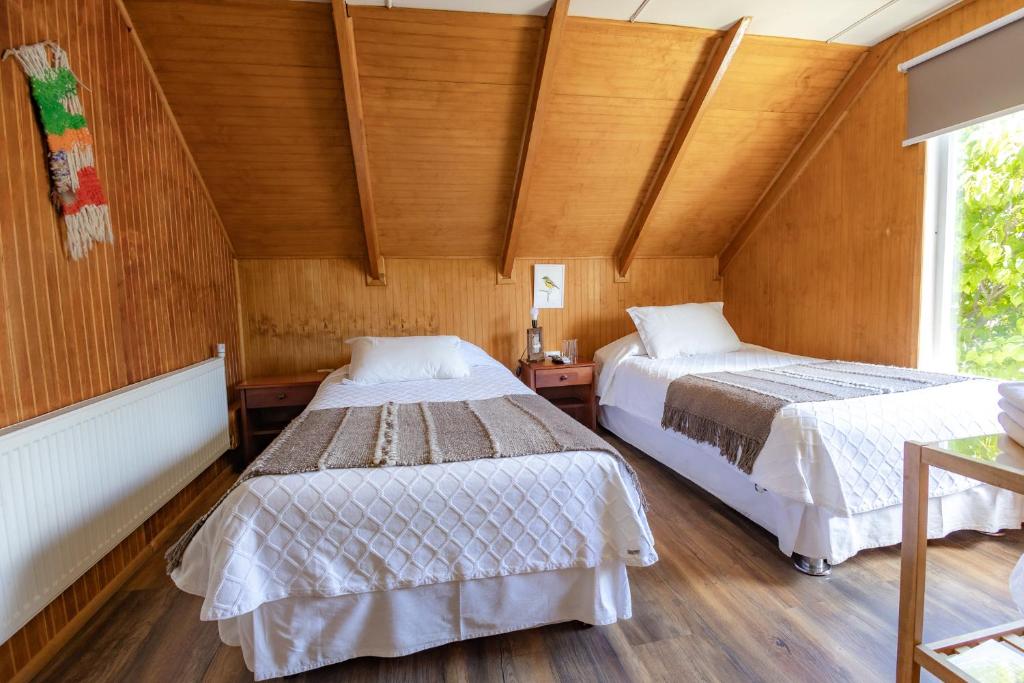 Postel nebo postele na pokoji v ubytování Hostal Viento Sur