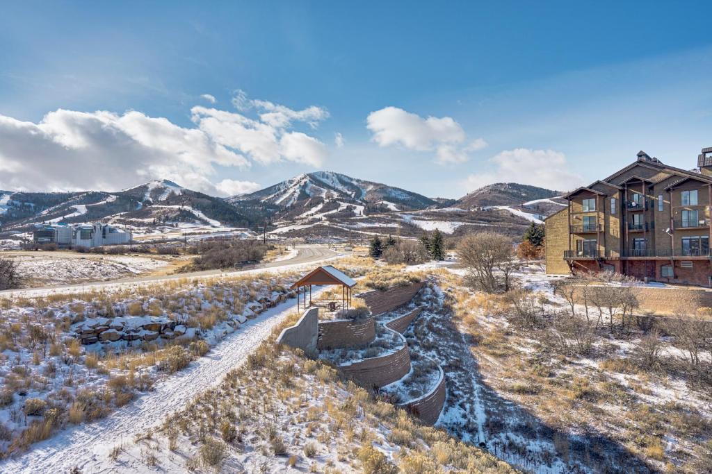an aerial view of a building in the snow at All-Season Heber City Condo with Stunning Views! in Heber City