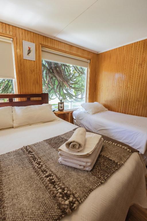 Postel nebo postele na pokoji v ubytování Hostal Viento Sur