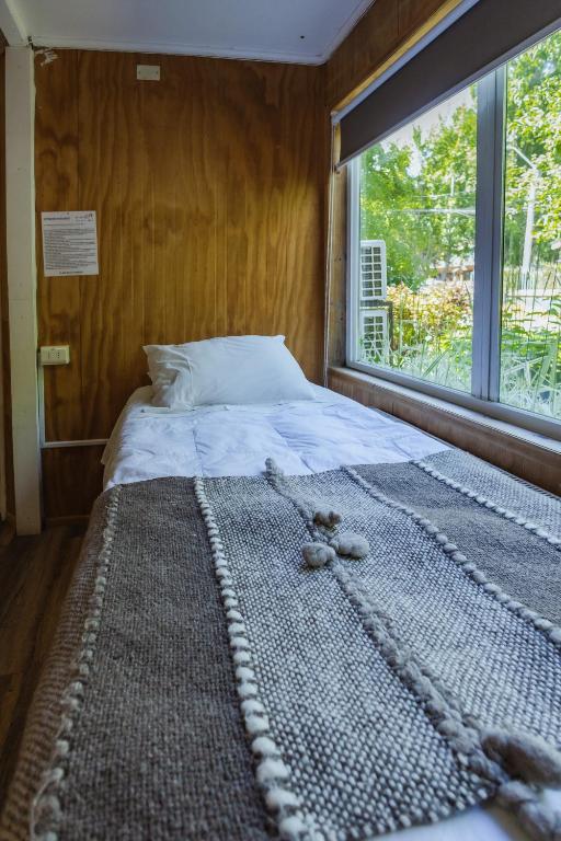 Postel nebo postele na pokoji v ubytování Hostal Viento Sur