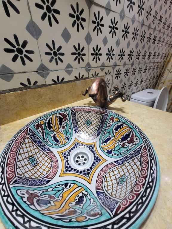 a colorful plate on top of a table at Honey Suckle in Chefchaouene