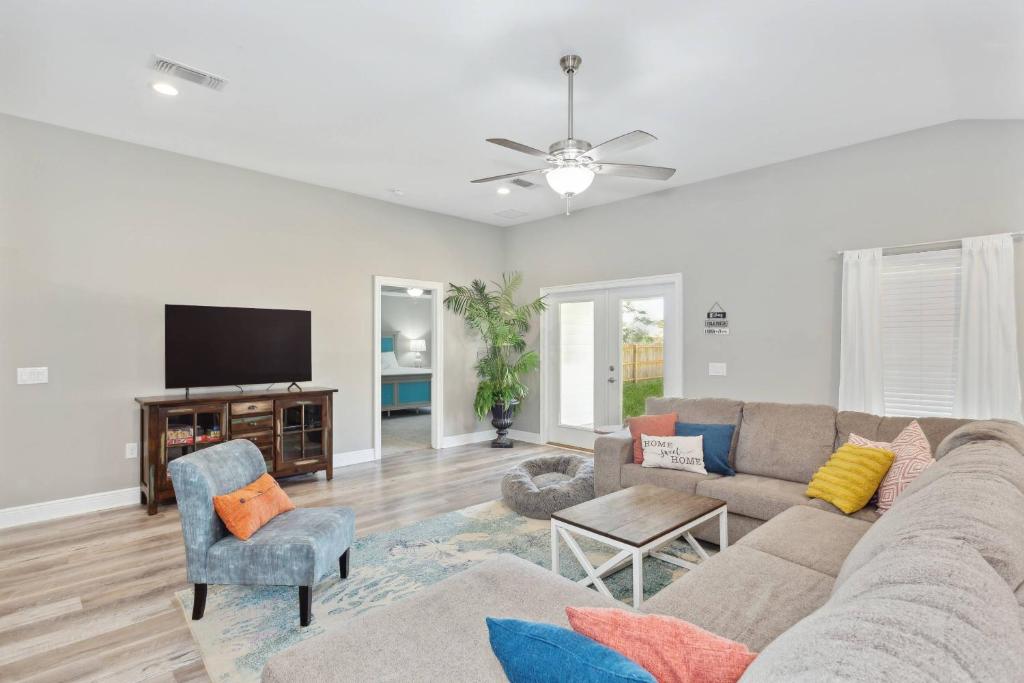 a living room with a couch and a tv at 1977 Esplanade St in Navarre