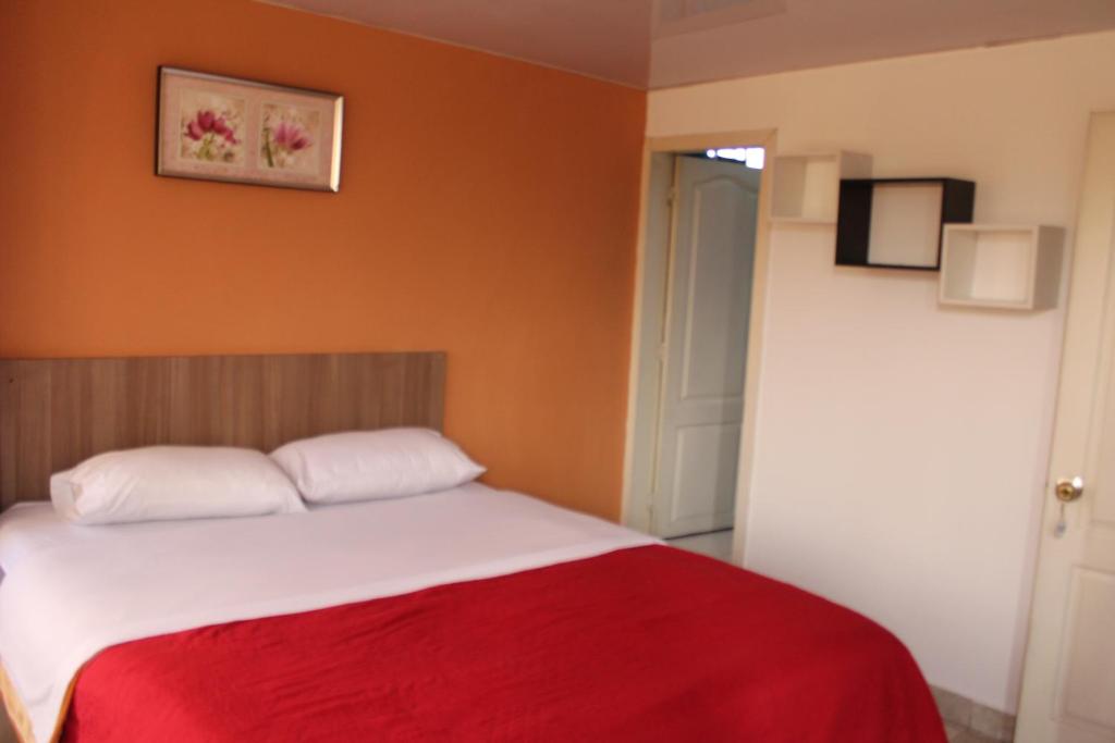 Postel nebo postele na pokoji v ubytování JULIUS Hostal