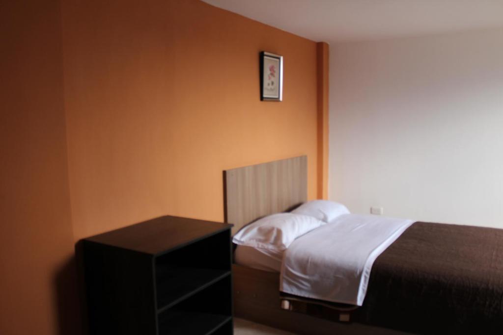 Postel nebo postele na pokoji v ubytování JULIUS Hostal