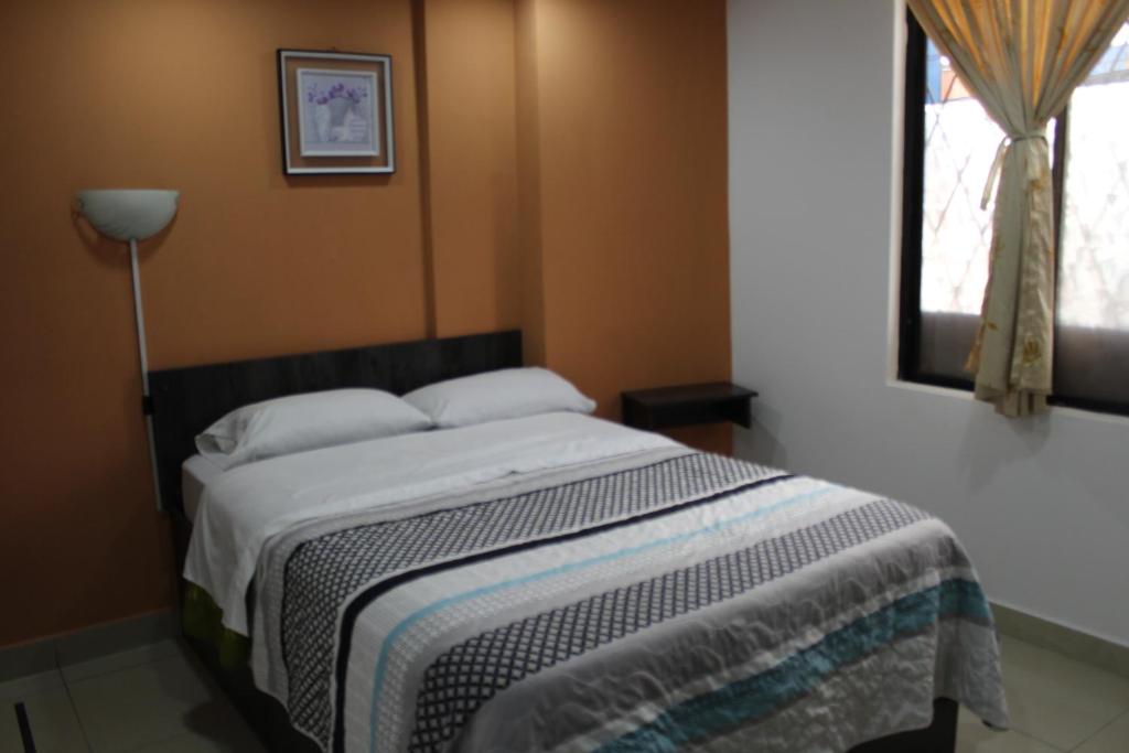 Postel nebo postele na pokoji v ubytování JULIUS Hostal