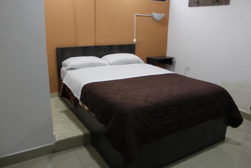 Postel nebo postele na pokoji v ubytování JULIUS Hostal