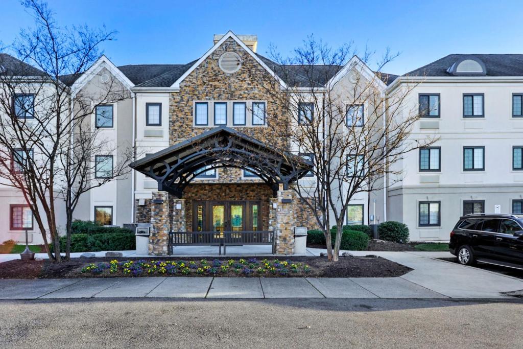 a house with a car parked in front of it at Staybridge Suites Columbia - Baltimore, an IHG Hotel in Columbia