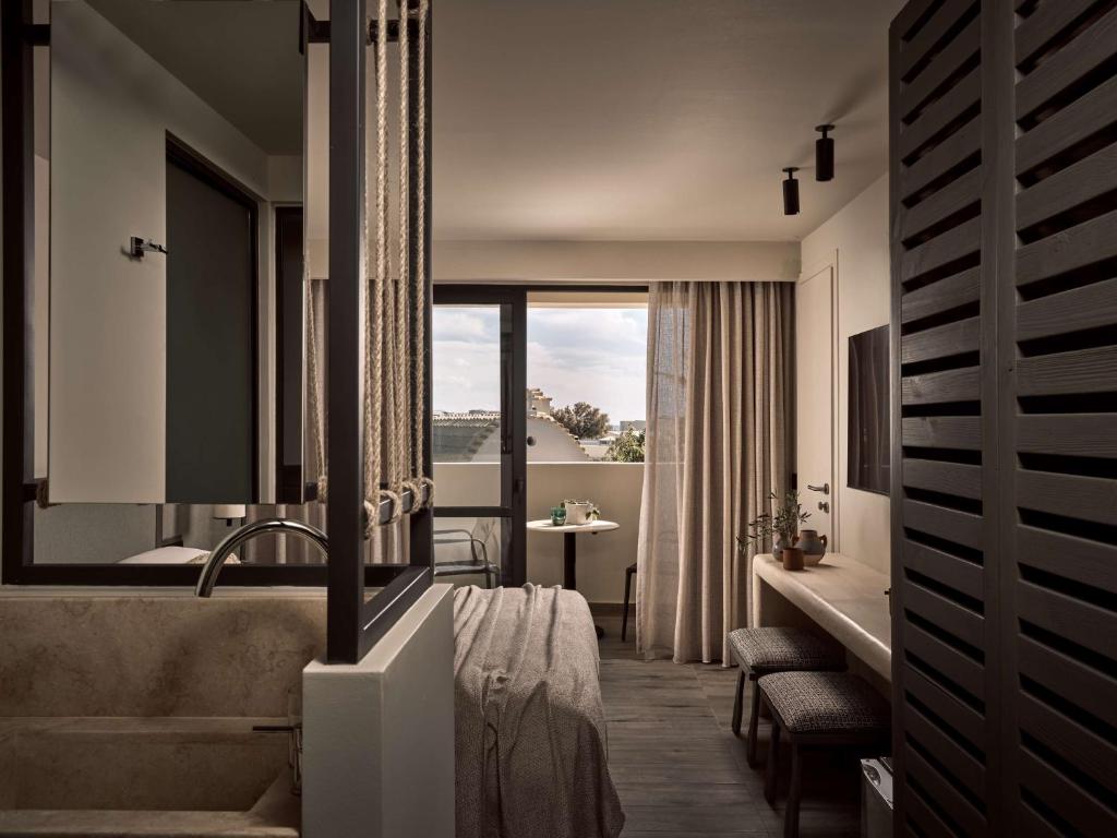 Posedenie v ubytovaní Numo Ierapetra Beach Resort Crete, Adults only, Curio Collection Hilton