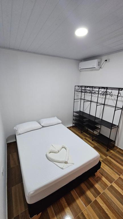 Postel nebo postele na pokoji v ubytování Family Amazon Minimalist