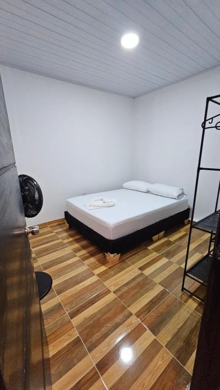Postel nebo postele na pokoji v ubytování Family Amazon Minimalist
