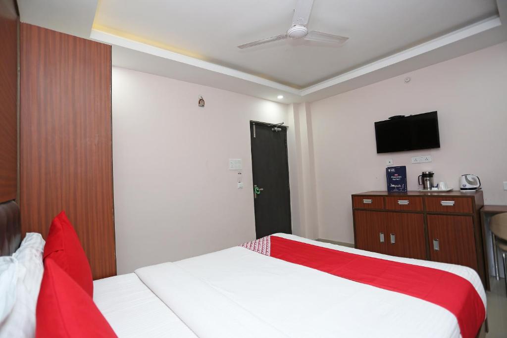 Posteľ alebo postele v izbe v ubytovaní Kamat Inn