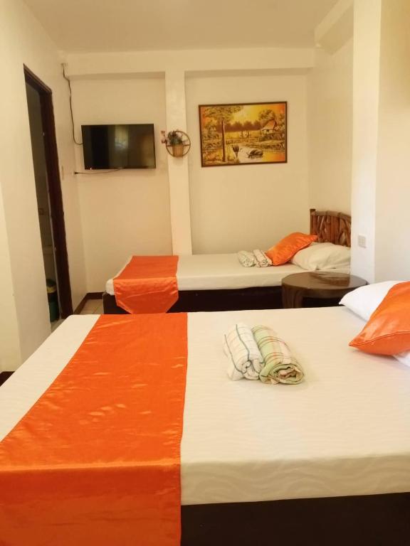 Postel nebo postele na pokoji v ubytování Isla Bonita Beach Resort