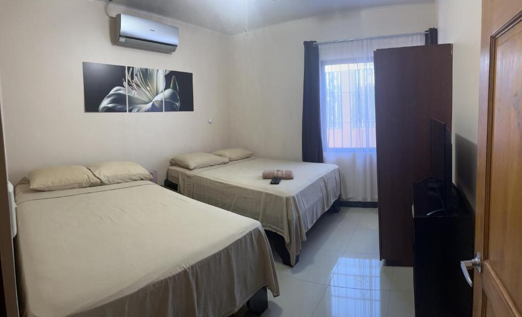 Postel nebo postele na pokoji v ubytování HOTEL DEL RiO