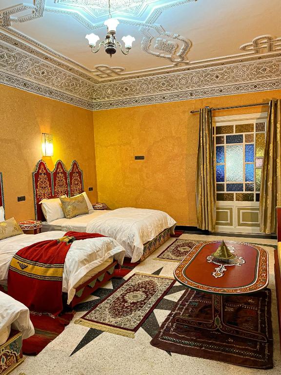Postel nebo postele na pokoji v ubytování Riad Dar Doura