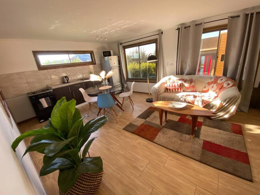 a living room with a couch and a table at Casa Josefa in Pelluhue