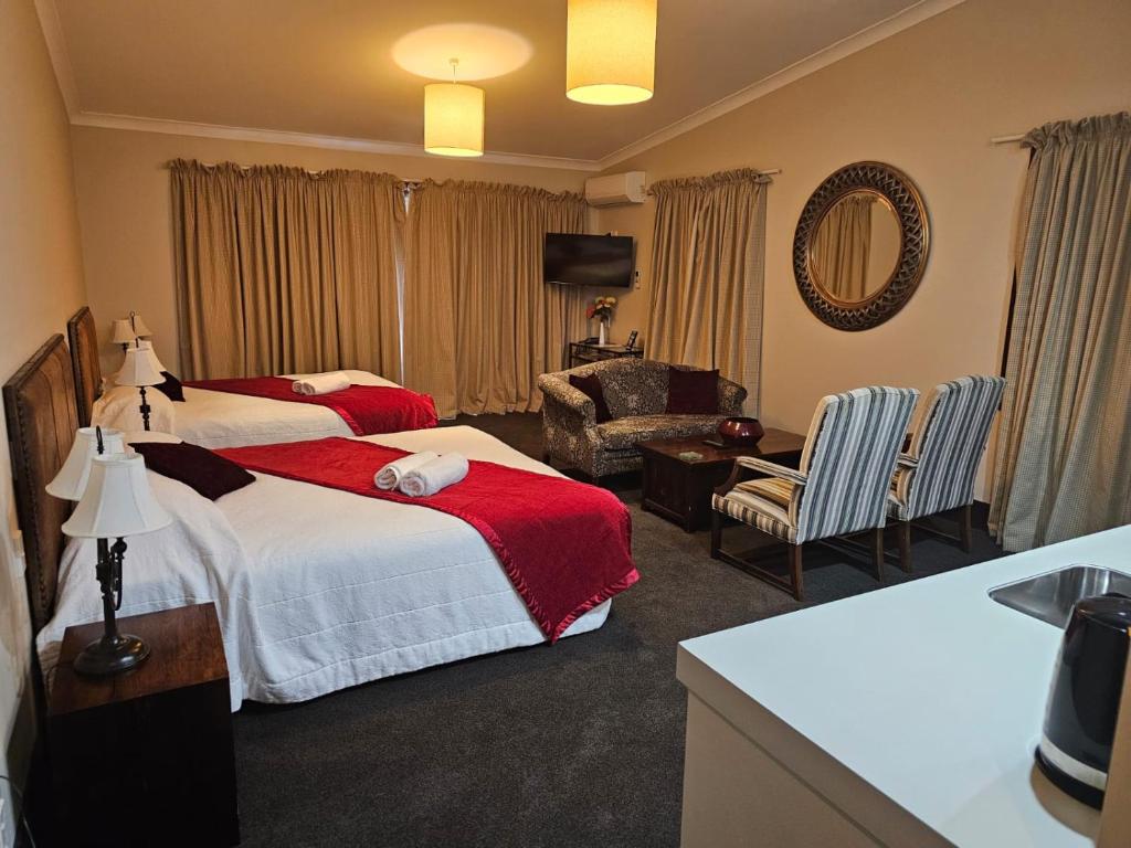 Postel nebo postele na pokoji v ubytování Gateway Motor Inn