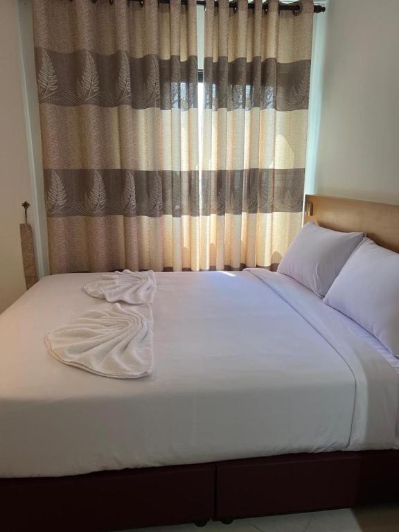 Postel nebo postele na pokoji v ubytování One Dream Hotel
