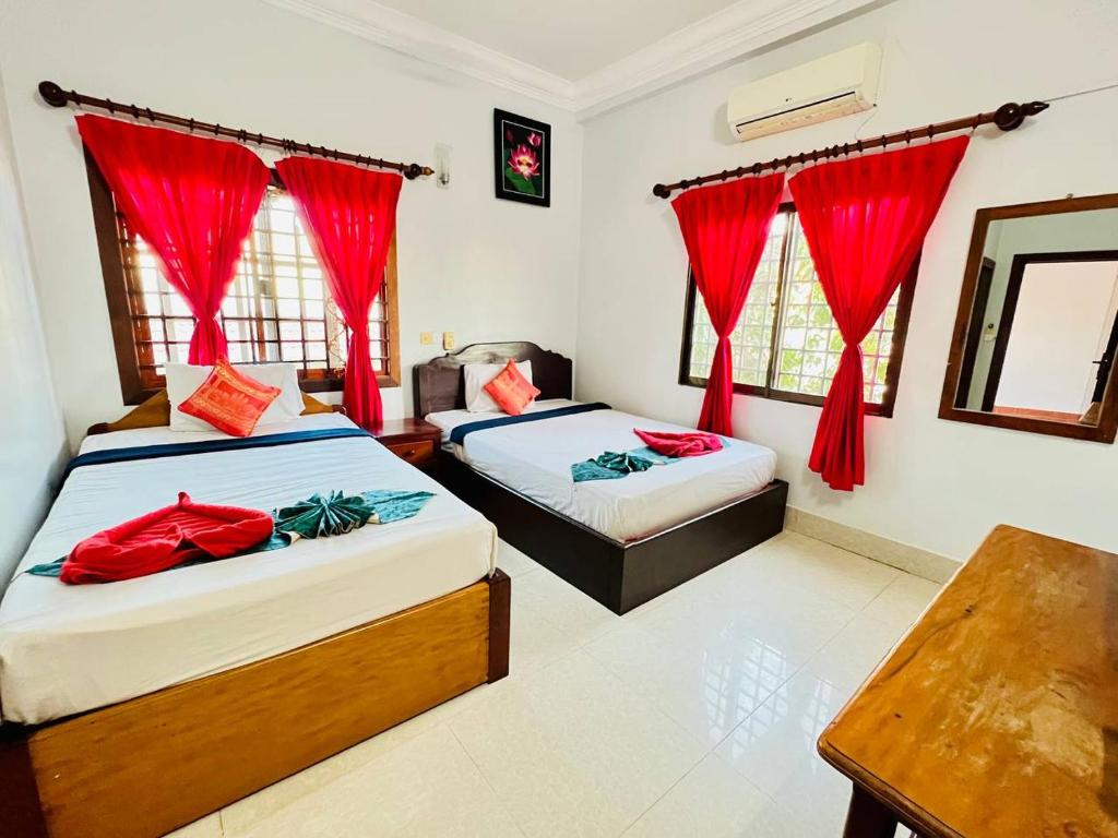 Postel nebo postele na pokoji v ubytování Golden Papaya Guesthouse