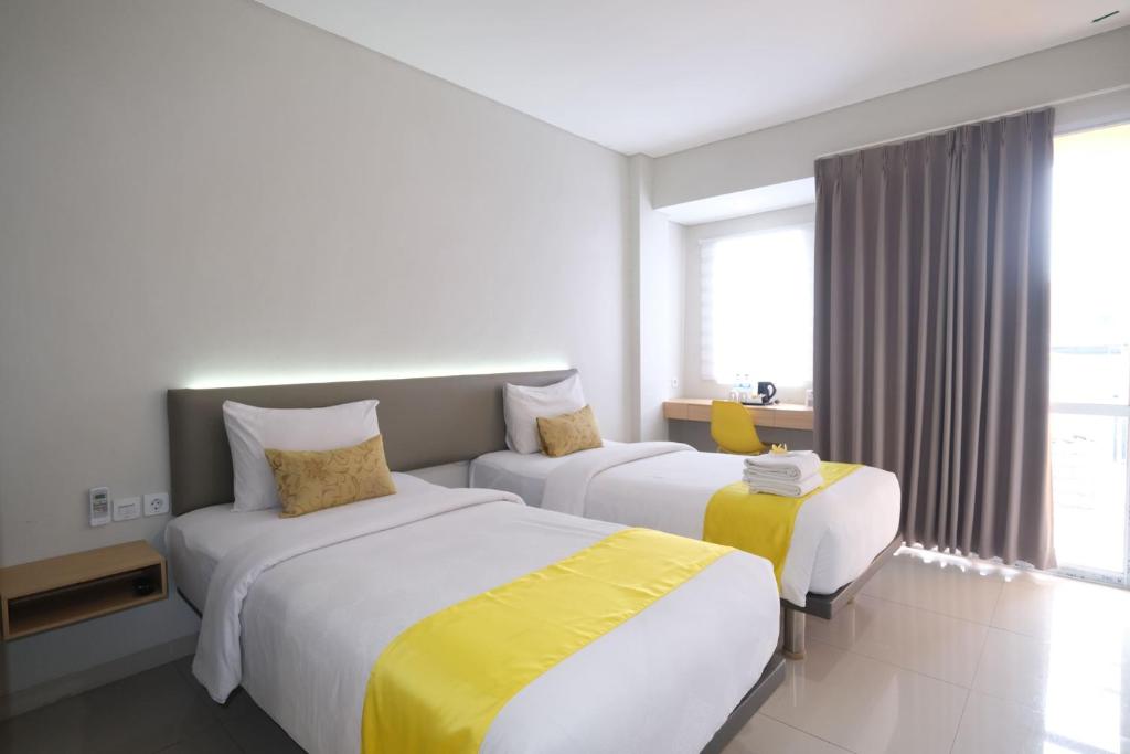 Postel nebo postele na pokoji v ubytování S101 Hotels